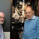 Michael Rossmann (right), Purdue University’s Hanley Distinguished Professor of Biological Sciences, and Richard Kuhn, director of the Purdue Institute for Inflammation, Immunology and Infectious Diseases, stand with the cryo-electron microscope used to determine the structure of the Zika virus. (Purdue University photo/Mark Simons)