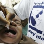 AFP/File - Nurse vaccinates child against polio 